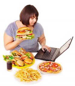 13309556-woman-eating-fast-food-at-work-isolated