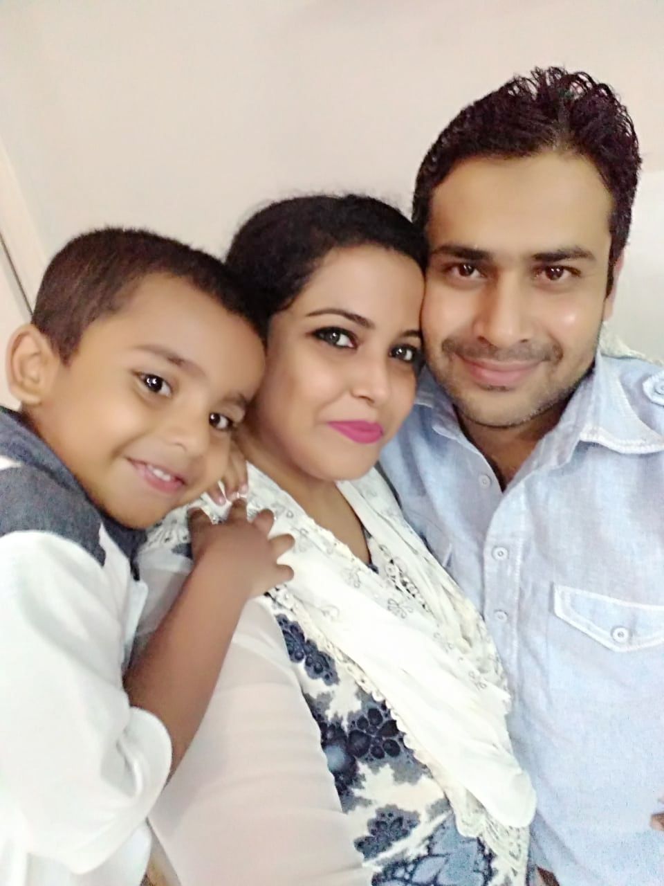 afreen with her husband and child