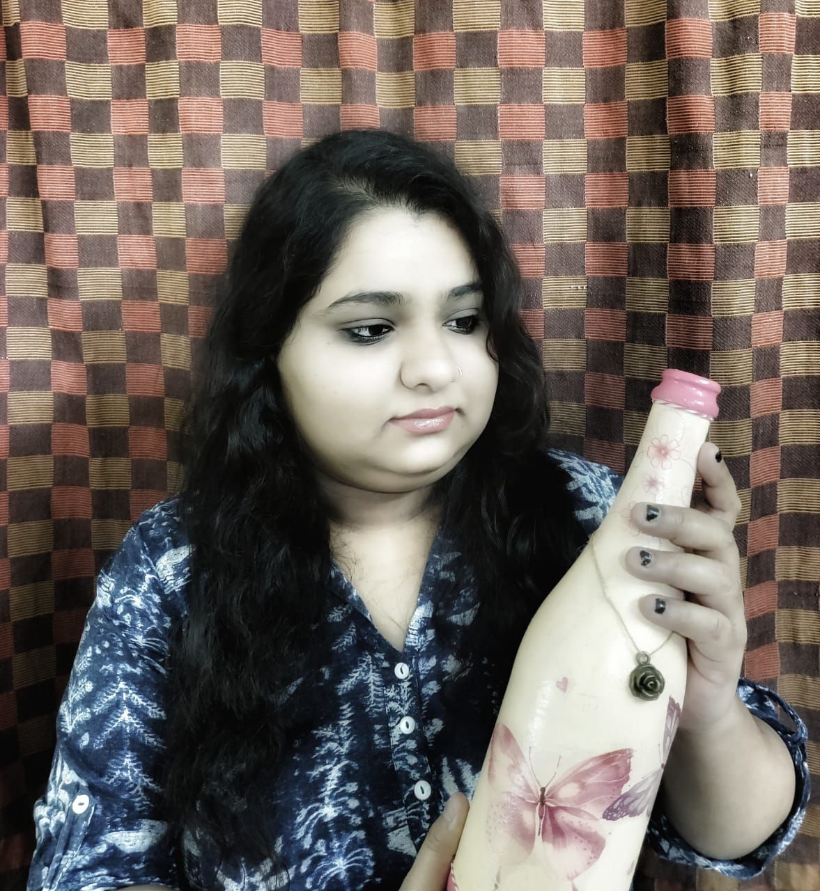 sabhyata looking at bottle