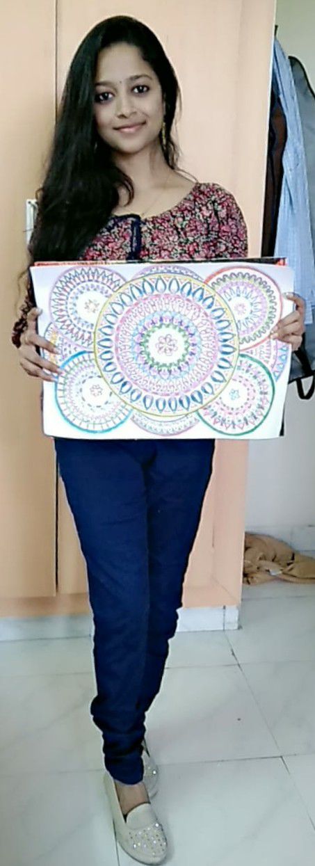 narayanee posing with her art